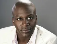 영화배우인 타이터스 버지스의 대표 이미지